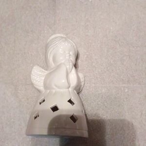 Ricotta white candle holder..5.5in tall, 3in wide, looks like a praying Angel